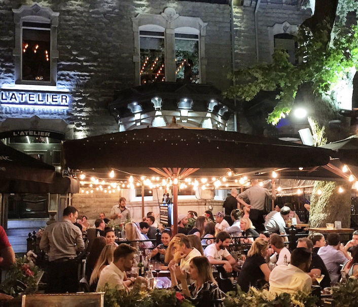 Just outside Quebec;s city walls there are long streets filkled with bustling cafes and bars.