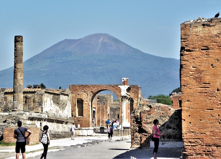 Tourists walk through the remains of Pompeii.