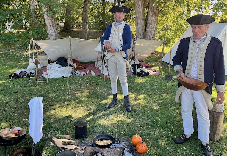 American Revolution reenactors pause for supper beside the field of battle in Saratoga, NY.