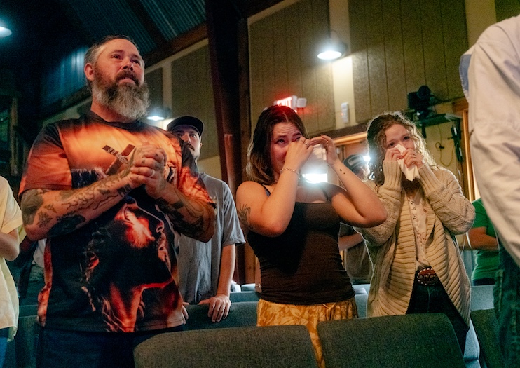 Community members grieve at the Cross Kingdom Church in Kerrville during the first Sunday service after the floods.