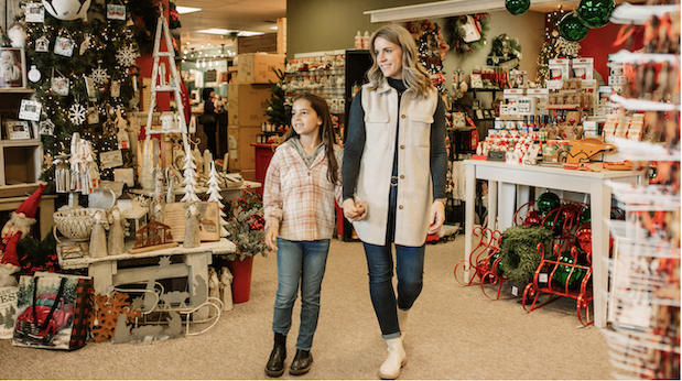 A mother and her daughter stroll through one of the town’s Christmas store, enjoying the holiday vibe.