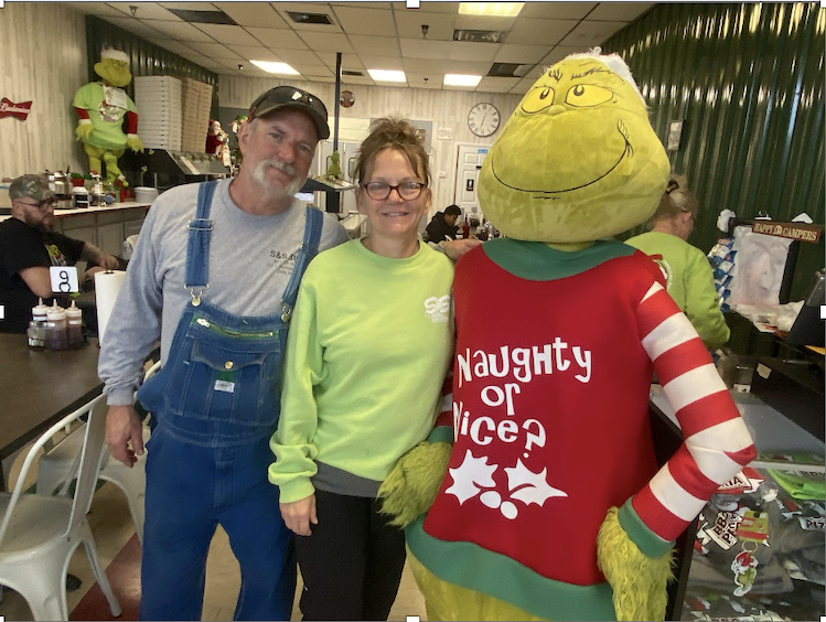 S&S Barbecue and Pizzeria's Grinch is the only one allowed in Santa Claus, Indiana. He works for owners Beth Schnell and her husband.