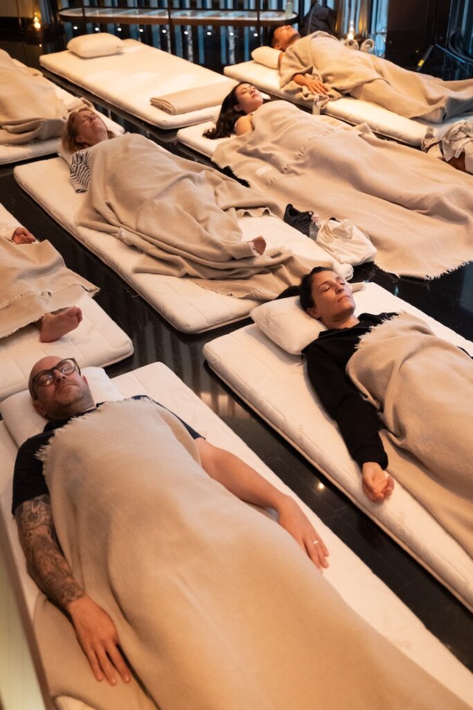 People experiencing a sound bath during the Global Wellness Summit in Dubai. 