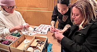Hotel guests at Kai Tsugaru receive instruction on Tsugaru Kogin-zashi, a traditional stitching handicaft in Aomori Prefecture copy