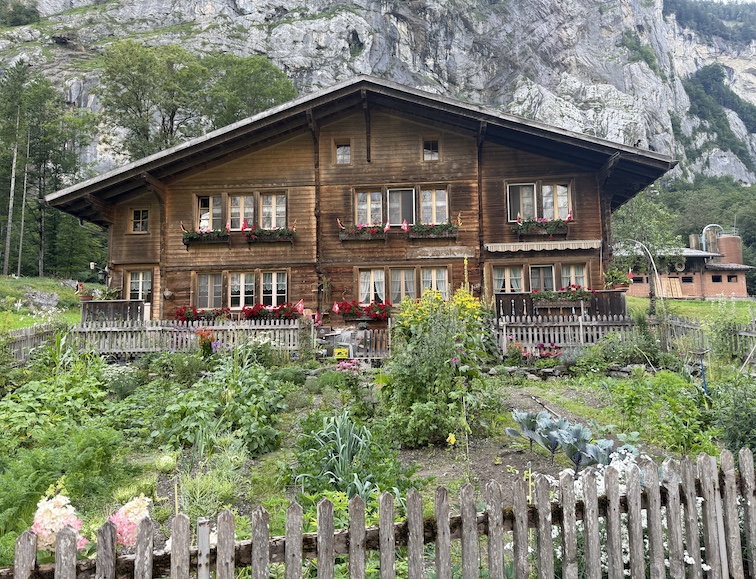 The Lauterbrunnen Valley Walk meanders past Swiss chalets, the Weisse Lütschine River, waterfalls, and pastures. 