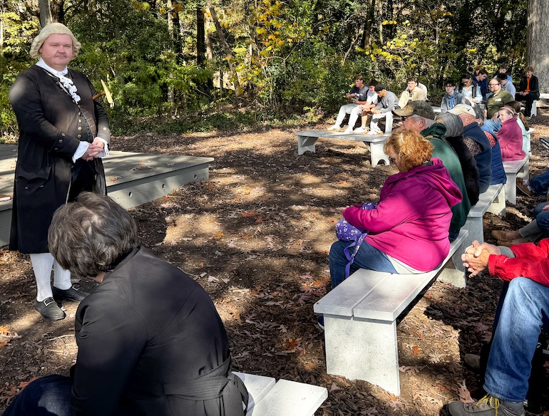 Actor portraying Declaration of Independence signer George Wythe tells visitors to Williamsburg what he thinks of George III.