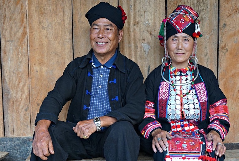 San Oula and Anle Laochu, members of the Oma hill tribe in remote Phongsali province, visit the Traditional Arts and Ethnology Center in traditional costumes.