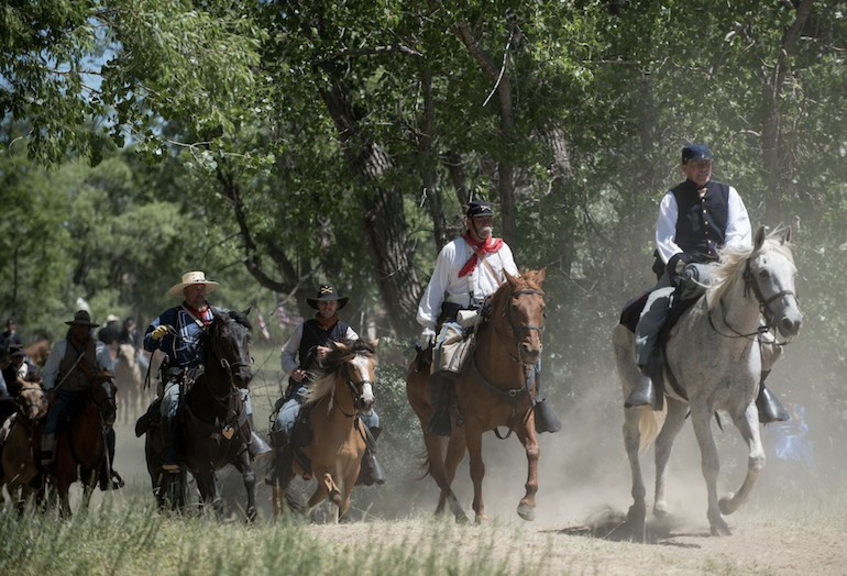 Costumed reenactors participate in the 150th Reenactment of the Battle of the Little Bighorn. The ceremony will take place on June 26-28, 2026.