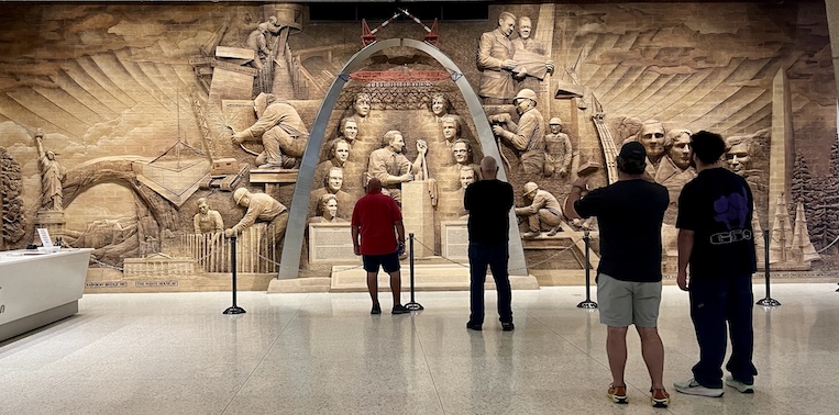 A brick mural in the Visitor Center commemorates those who made the Arch a reality and compares the Arch's size to other buildings and monuments. 