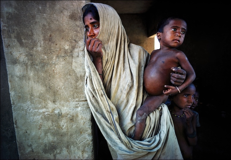 Mother with starving children in 1974 Bangladesh famine