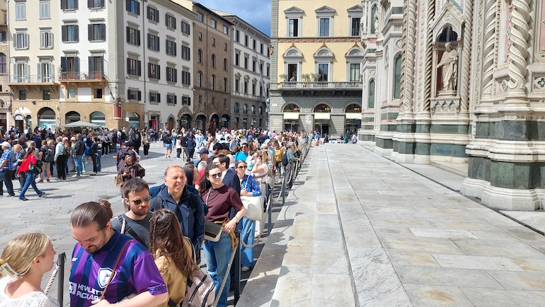 A long line of tourists waiting to enter Florence’s Duomo.