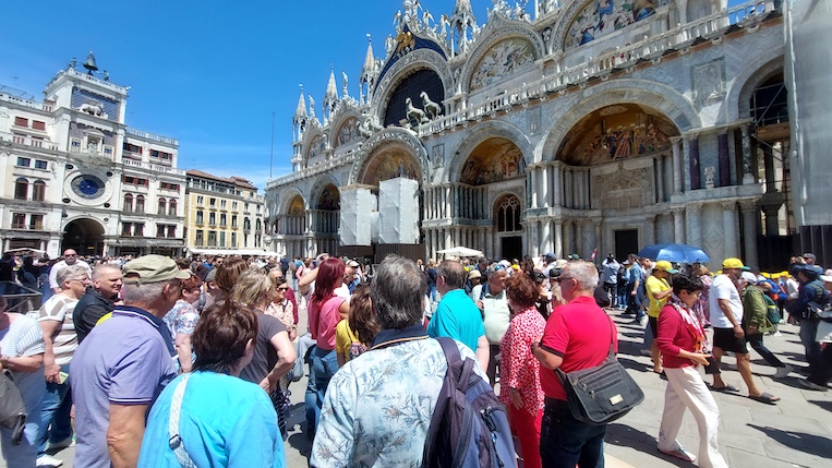 Afternoon crowds in Venice outside St. Mark’s Basilica, typical of the daily tourist crush in St. Mark’s Square.