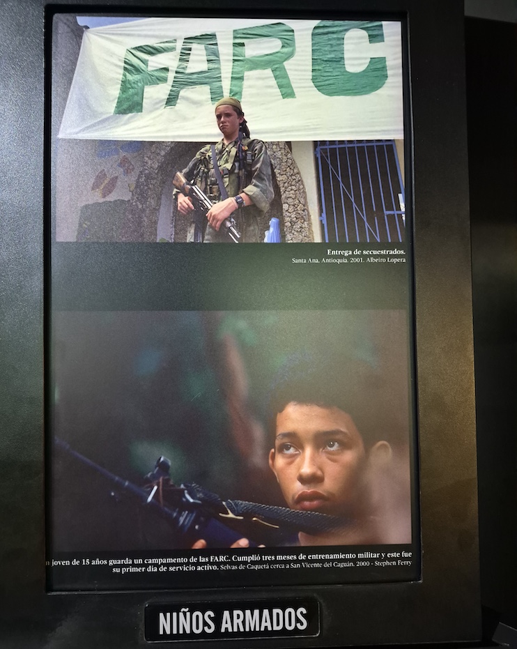 Casa de la Memoria exhibit showing teenagers forced to become armed guerillas by drug cartels.