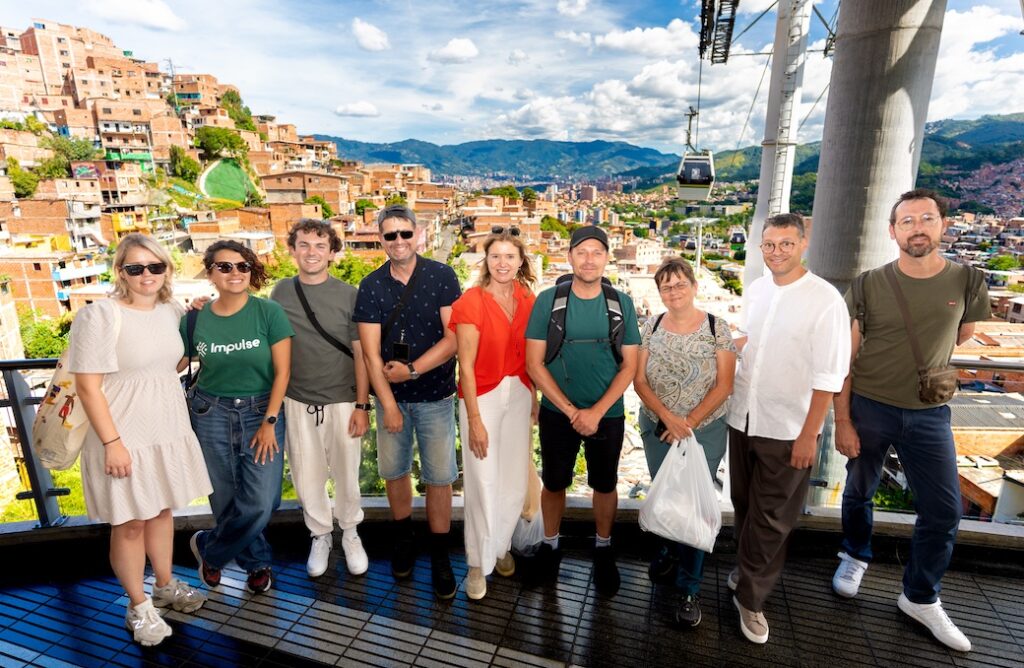 Tour leader and CEO Juliana Medina, second from left, with guests at Medellin Cable car Station courtesy Impulse Travel.jpg