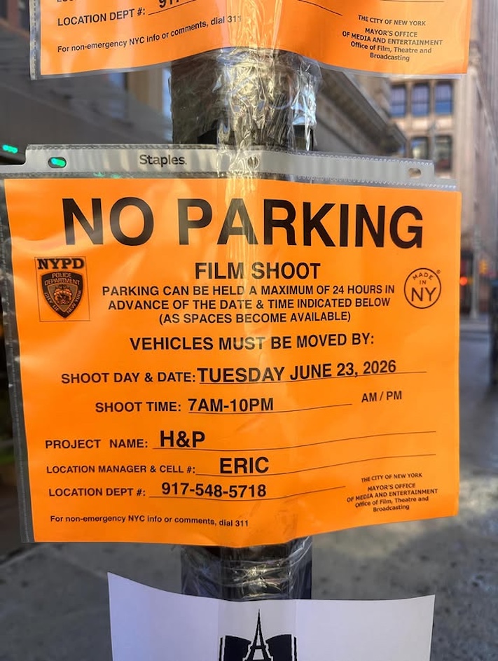 No Parking notices limit public parking next to filming locations.