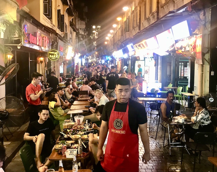 After dark, the busiest lane in Hanoi’s Old Quarter is Phõ Tà Hiên, where restaurant owners welcome international guests to enjoy local cuisine and beer well into the night.