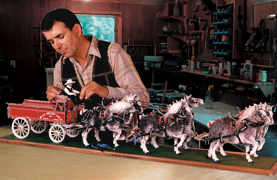 Man carving an Amish Teamster with six horses pulling his wagon.