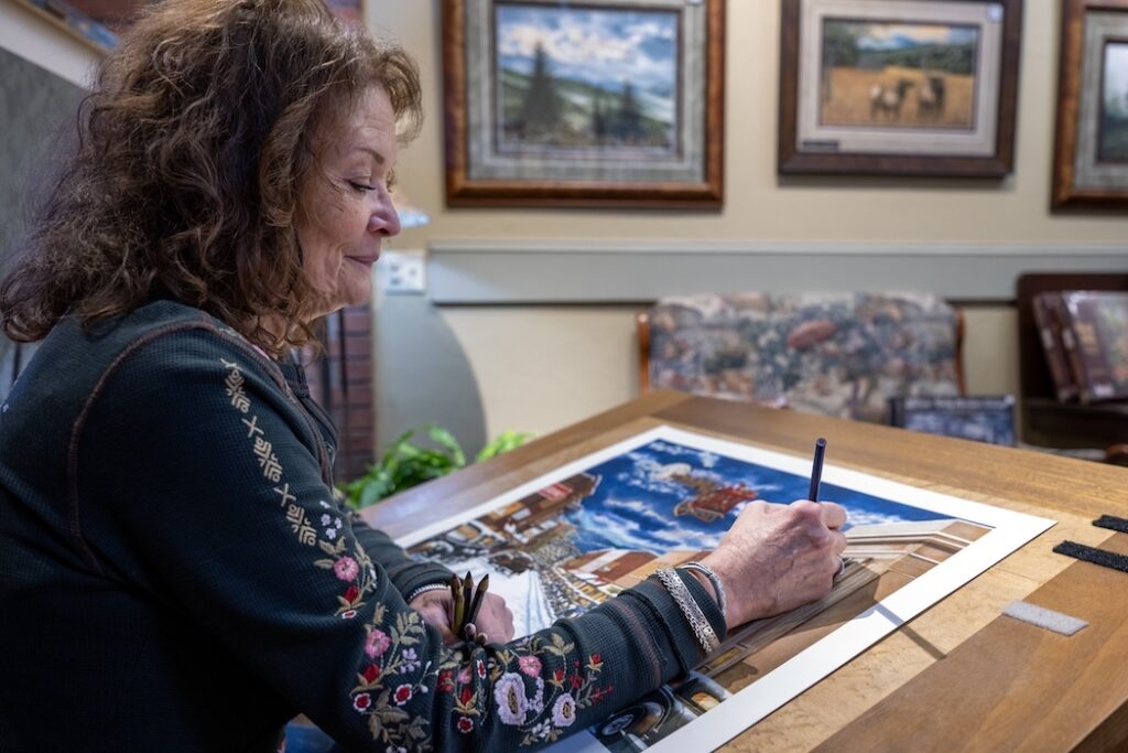 Artist Teresa Pennington works on a colored-pencil drawing at Pennington Art Gallery in downtown Waynesville.